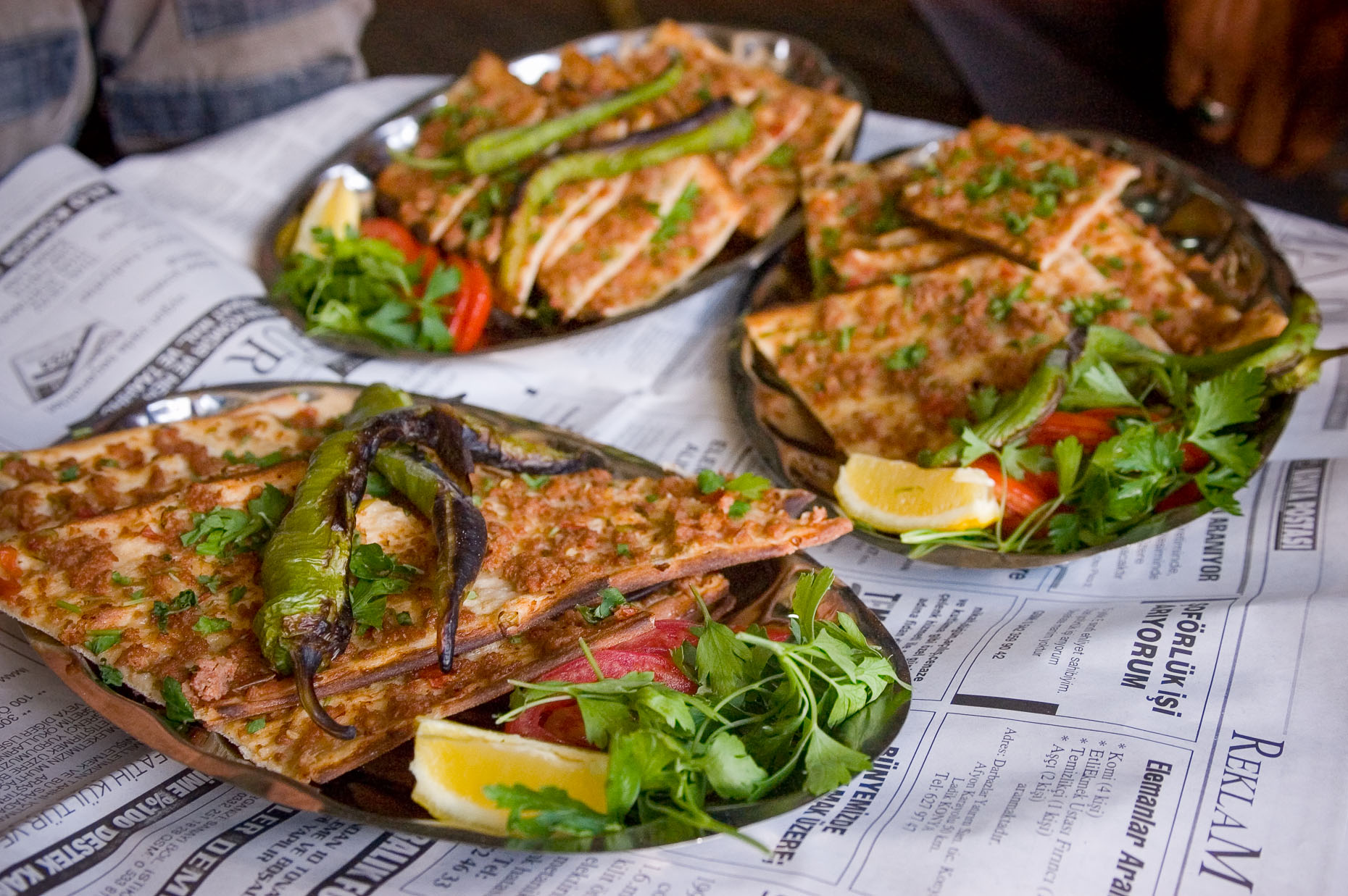 Photo of traditional food ekmek bread with lamb and cilantro and peppers. 