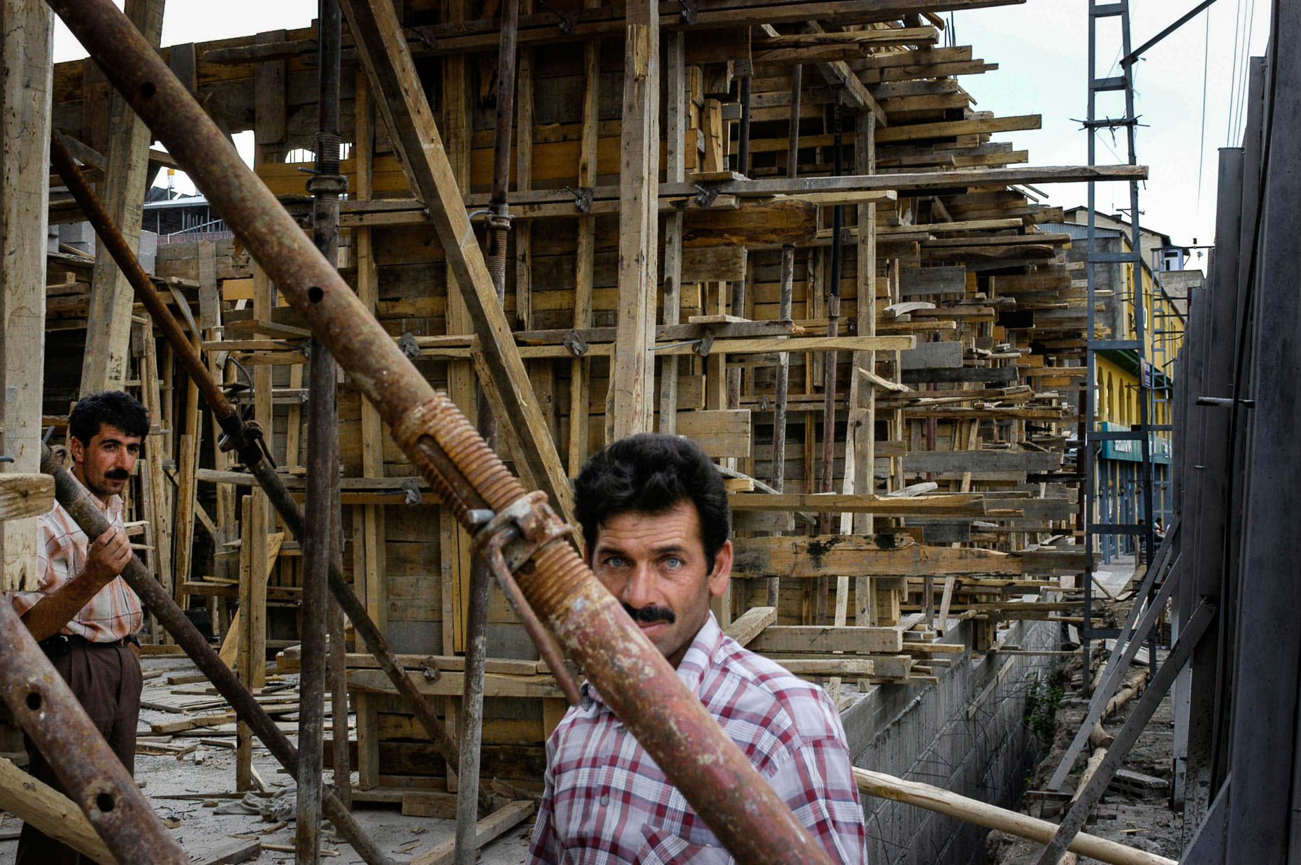 Portrait of construction worker building apartment structure in Van Turkey.