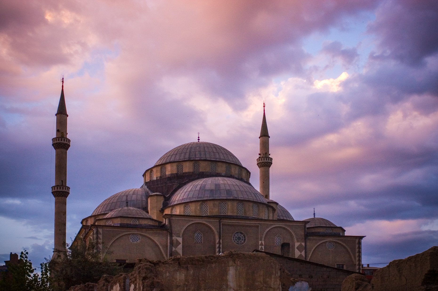 Image of Muslim mosque and minarets in Van Turkey at sunset. 