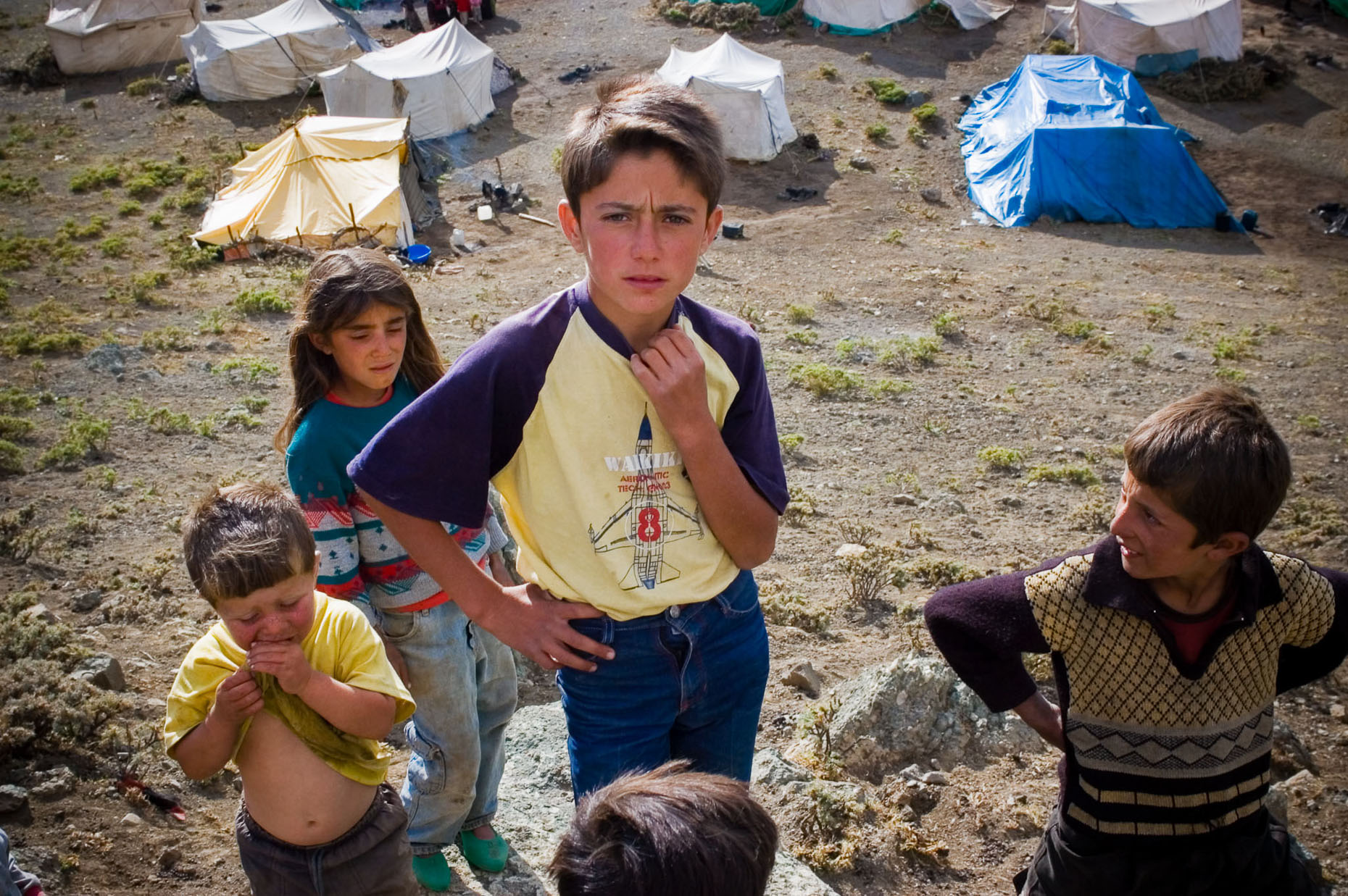 Environmental portrait of nomadic Kurdish village kids and tents near Syrian border, Turkey. 