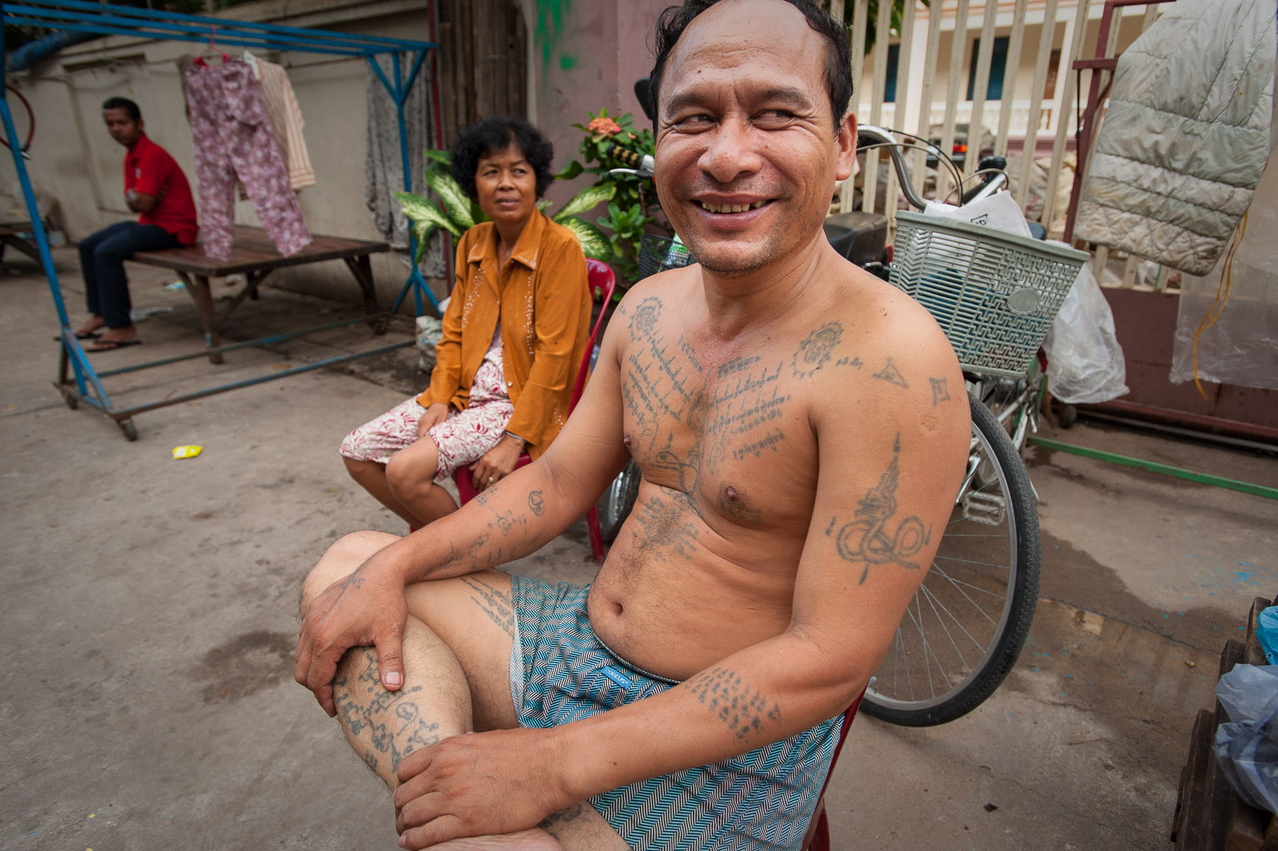 Man with traditional Khmer war tattoos, Phnom Penh Cambodia.