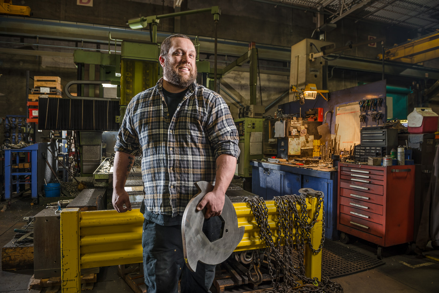 Dramatic environmental portrait of metal fabricator
