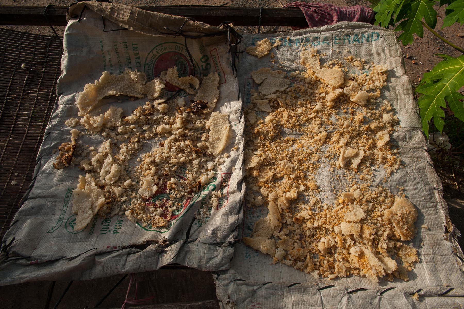 Drying salt in sun on burlap, Kampot Cambodia. 