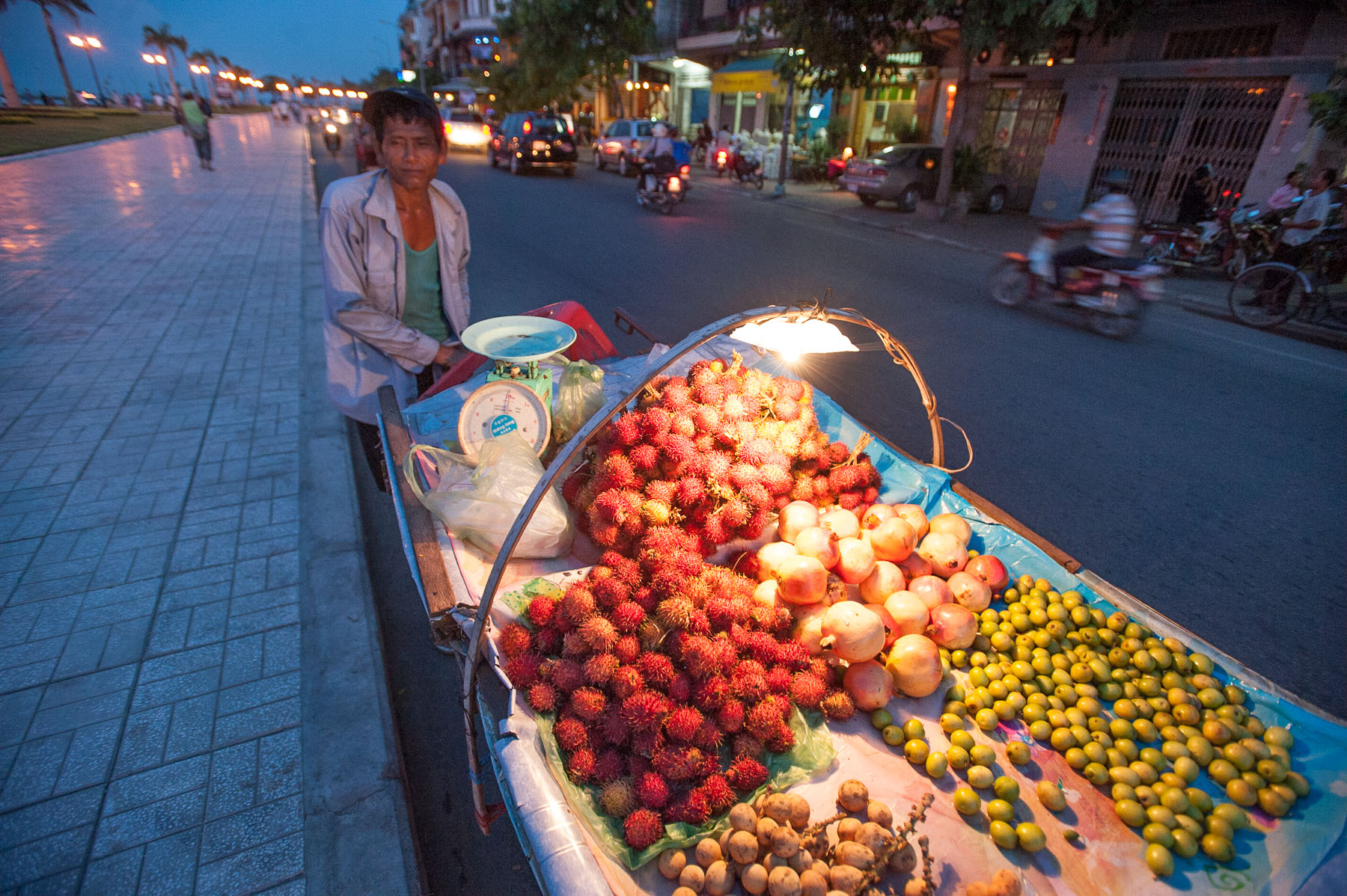 Lychee fruit street side vendor along Mekong River, Phnom Penh Cambodia. 