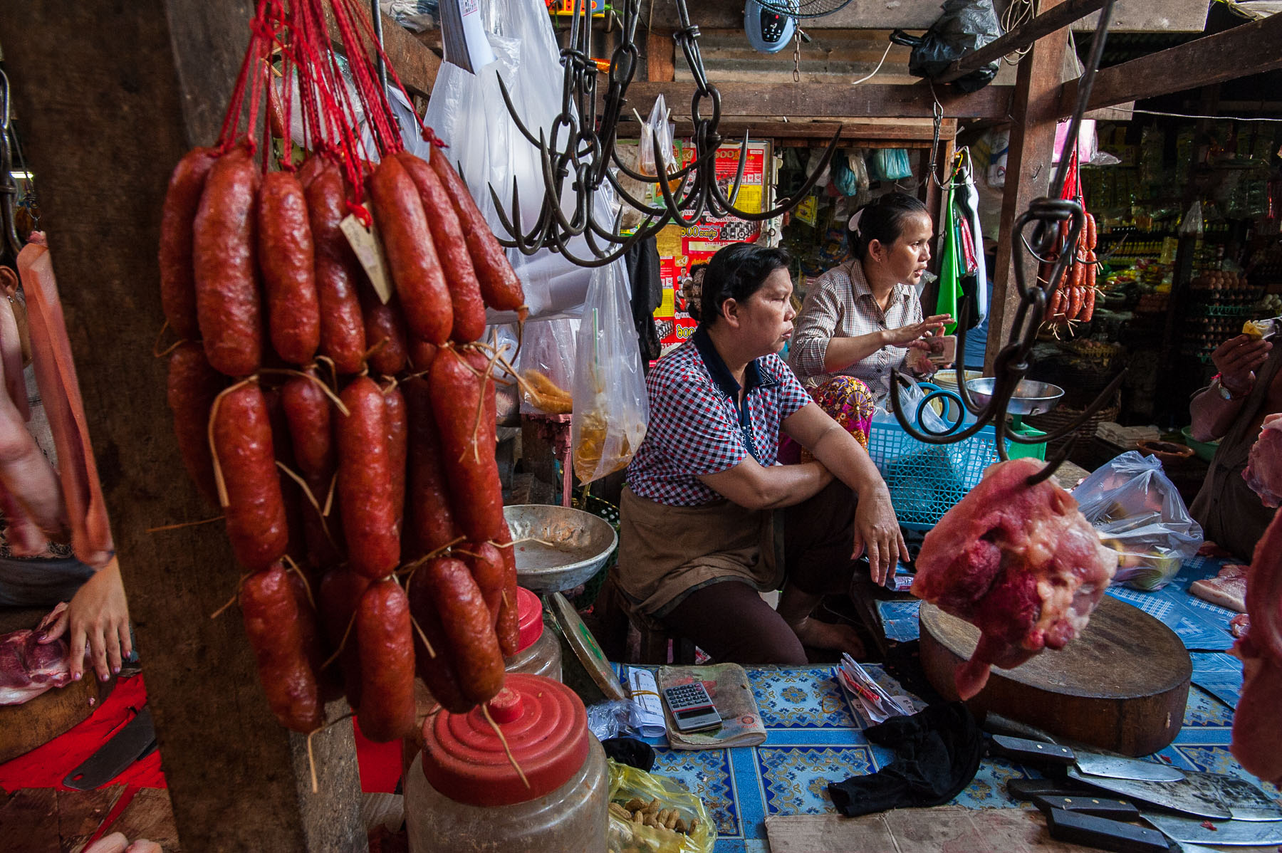 Meat vendor in Russian market, Phnom Penh, Cambodia.